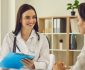 Dentist with a patient discuss dental insurance verification